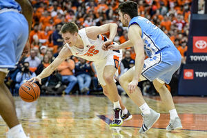 Our beat writers predict Syracuse will lose to UNC as the Orange return to ACC play. 