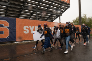 Athletes from multiple sports marched through the snow and wind to promote Black Athletes Lives Matter.