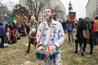 Jonas Fricke, the founder of his own traveling puppet show, participates in the peaceful protest at McPherson Square.